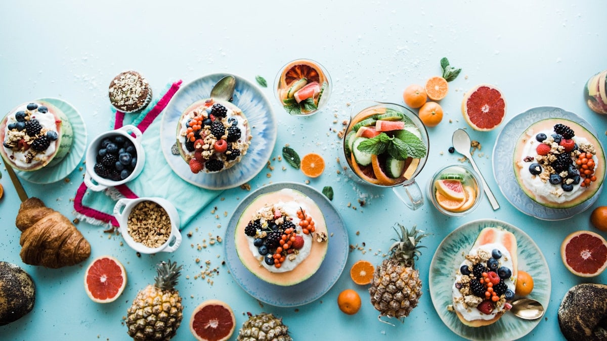assorted fruits on white ceramic bowls